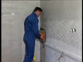 laying ceramic tiles on the wall